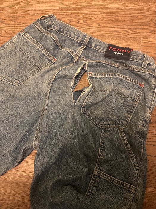 Large rip in the back of a pair of jeans